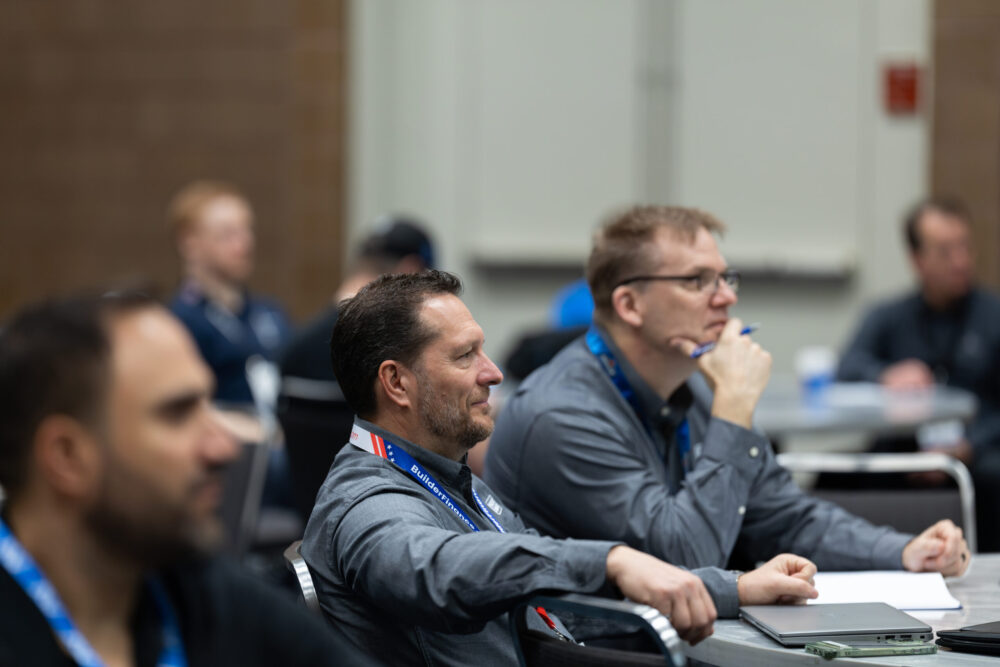 Attendees taking notes during a General Business Track session at HPBExpo
