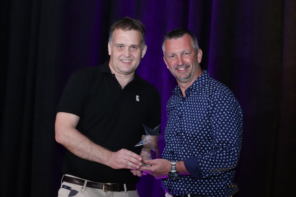 Stoll Industries accepting the Hearth product award at HPBExpo26